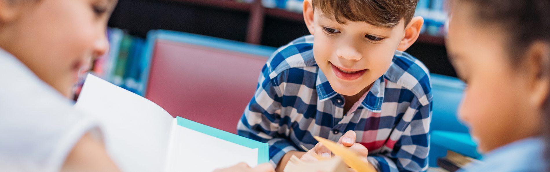 cute-little-kids-reading-books-in-library-XYN7H5T